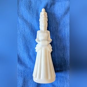 Vintage Avon Milk Gass lady holding unforgettable foaming bath oil